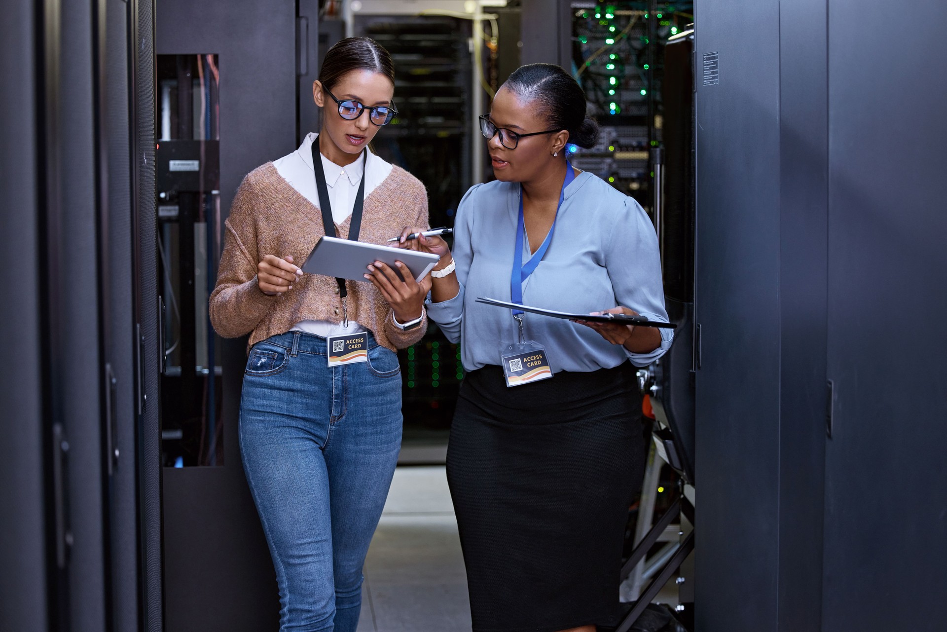 Cropped shot of two attractive young female computer programmers working together in a server room